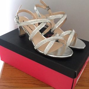 Silver heels never worn brand new